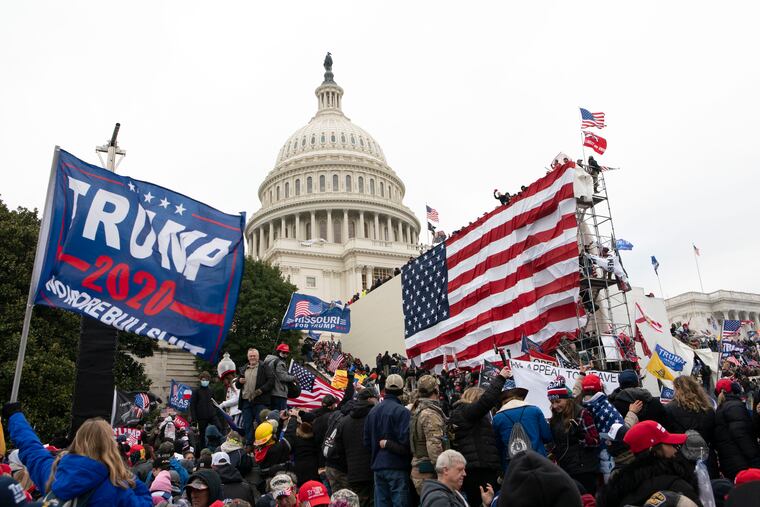 Supporters of President Donald Trump stand outside the U.S. Capitol in Washington on Jan. 6.