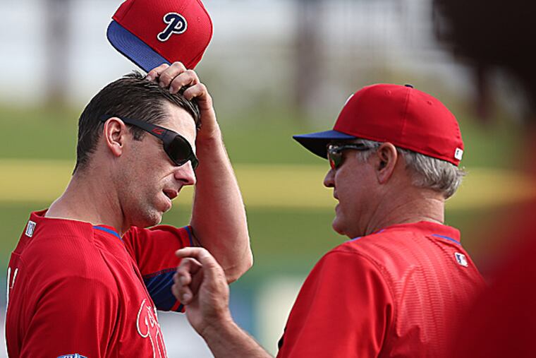 Phillies starting pitcher Cliff Lee and manager Ryne Sandberg. (David Maialetti/Staff Photographer)