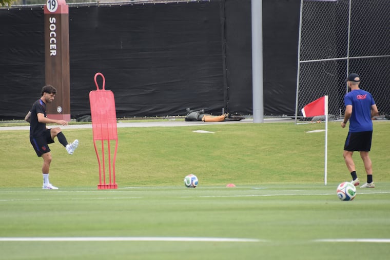 Christian Pulisic (left) working with a coach during Wednesday's U.S. practice.