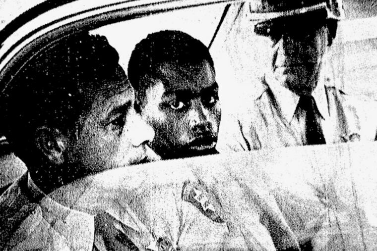 FILE - In this February 1964 file photo, Henry Montgomery, flanked by two deputies, awaits the verdict in his trial for the murder of Deputy Sheriff Charles H. Hurt in Baton Rouge, La. A three-member board will hear the case of Henry Montgomery on Thursday, April 11, 2019. The 72-year-old Montgomery was convicted of killing Hurt in 1963. Montgomery was 17 at the time. (John Boss / The Advocate via AP, File)