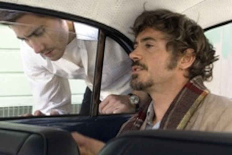 Jake Gyllenhaal (left), Robert Downey Jr. are newsmen pursuing a '70s serial killer in "Zodiac," an enthralling thriller obsessed with obsessives.