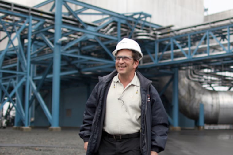 Mike Polachek walks in the pollution-control area of the Mercer Generating Station near Trenton. The plant has reduced emissions 90 percent or more. (David Swanson / Staff Photographer)
