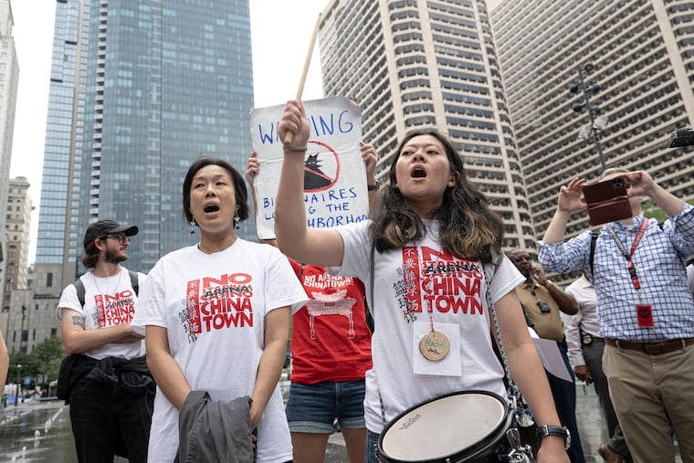 Supporters and Chinatown leaders gathered during a protest against the proposed Sixers arena on Wednesday outside City Hall.