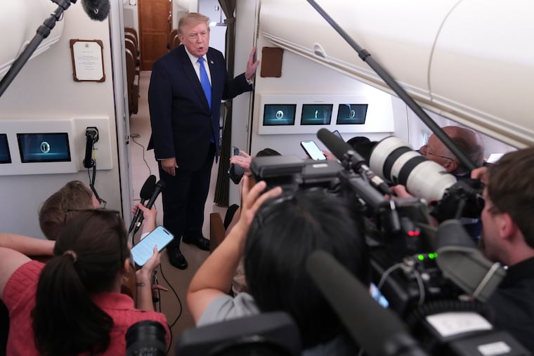 President Donald Trump speaks to reporters onboard Air Force One while returning to the White House, Sunday, Aug. 2, 2026.