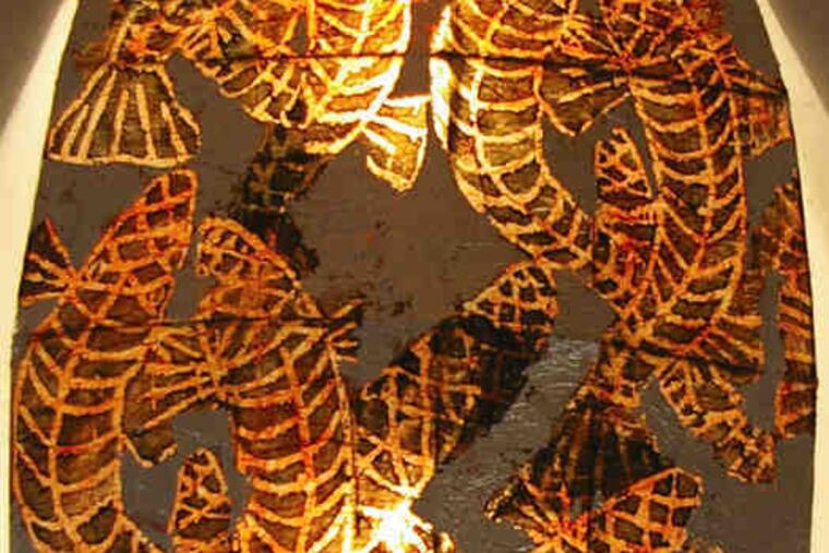 "Silver Sea Luminary," left, a woodcut print from Frank Hyder's show in Northern Liberties, and "September Reflection III," an acrylic on canvas from Gerry Tuten's exhibit in Rosemont.