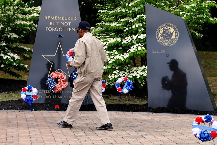 Representing those fallen in his branch of service, Ernest Scott, of Deptford, who served in the U.S. Army from 1959-67, places a wreath during Memorial Day ceremonies at Veterans Memorial Park.