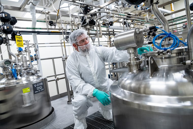 Ben Avery, a senior manufacturing manager at Partner Therapeutics, inspects tanks that are part of the process to make Leukine, which is being researched as a treatment for Alzheimer's disease.