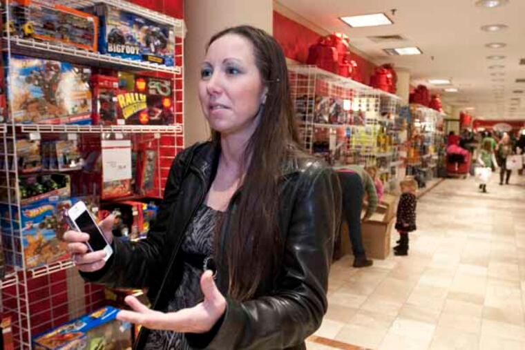 Jennifer Thomson of Roxboro shops at Macy's for gift items for her nephew on December 20, 2012. ( RON TARVER / Staff Photographer )