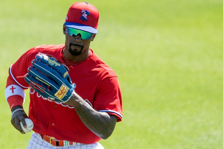 Phillies outfielder, Andrew McCutchen fields a ball during spring training practice at Spectrum Field in Clearwater, Fla. Tuesday, February, 23, 2021.