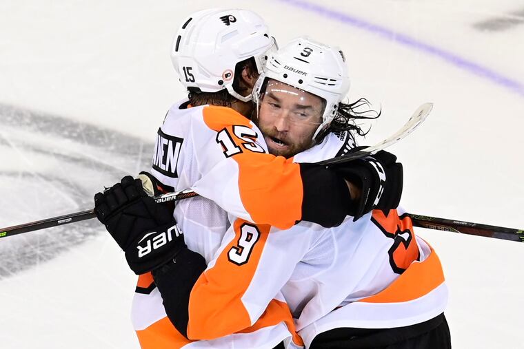 Feel the emotion. Ivan Provorov gets a hearty embrace from defense partner Matt Niskanen after Provorov's double-overtime goal on Thursday night forced Game 7 (Saturday, 7:30 p.m.).