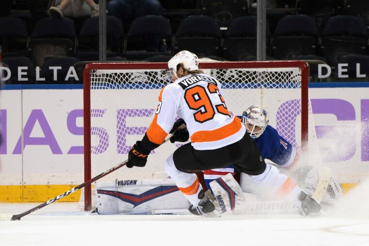 Flyers forward Jake Voracek (93) scores in overtime against the Rangers' Keith Kinkaid on Monday night.
