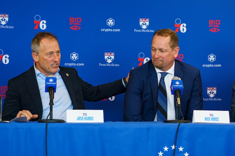 Josh Harris (left), pictured at new Sixers coach Nick Nurse's introductory press conference, is aiming to purchase a third professional sports team.