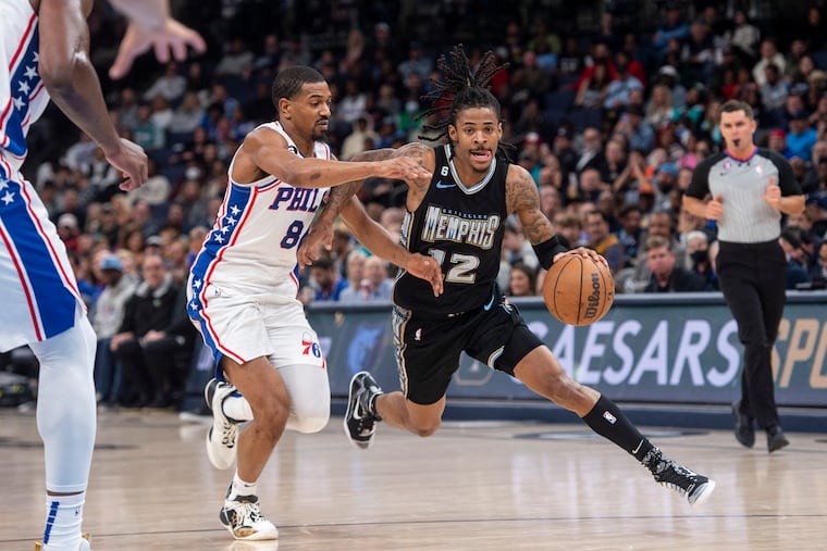 Memphis Grizzlies guard Ja Morant handling the ball against 76ers guard De'Anthony Melton on Friday.