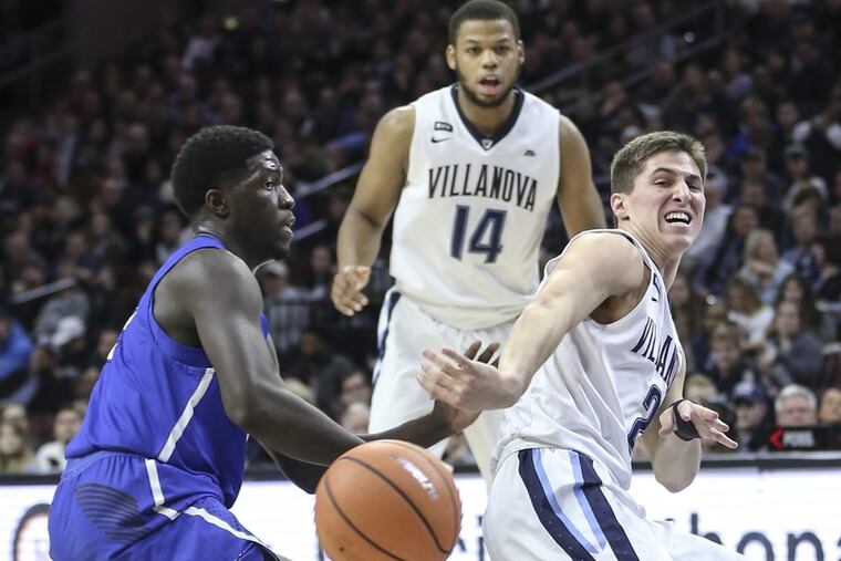 Villanova freshman Collin Gillespie, an Archbishop Wood graduate, shows a pass around Creighton’s Khyri Thomas during the 1st half at The Wells Fargo Center, in Philadelphia, Tuesday, February 1, 2018.