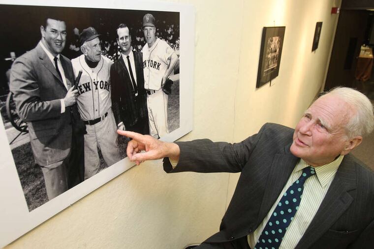 In this file photo, Broadcast pioneer Lew Klein points to an image of himself with N.Y. Mets Casey Stengel and Richie Ashburn.