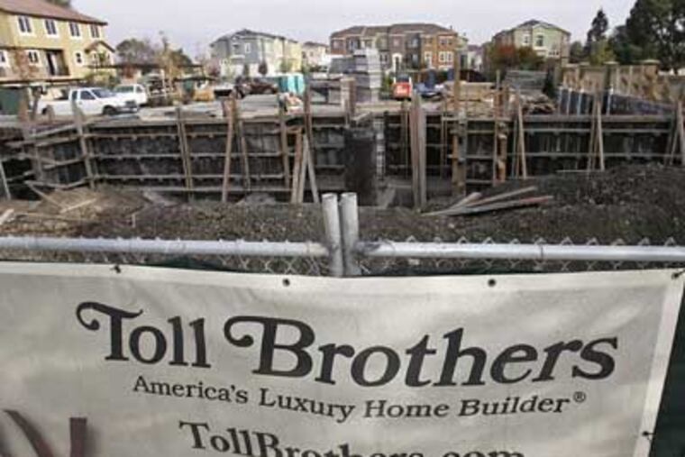 Toll Brothers Inc. said Thursday its fiscal fourth-quarter loss narrowed slightly as it took fewer write-downs on land values, but warned that fiscal 2009 revenue will fall significantly below 2008 levels. (Paul Sakuma/AP Photo)