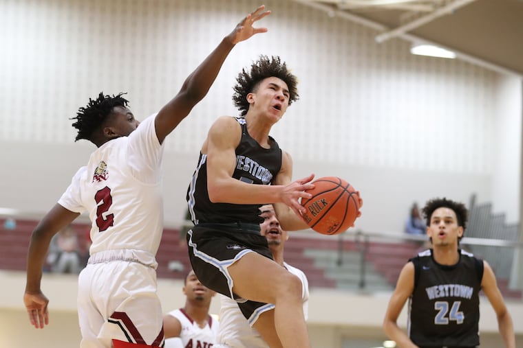 Jalen Warley of the Westtown School drives to the basket against against Dylan Coq of the Academy of the New Church in a recent game.