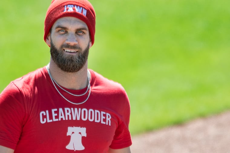 Phillies Bryce Harper looks on during spring training practice in Clearwater, Fla.
