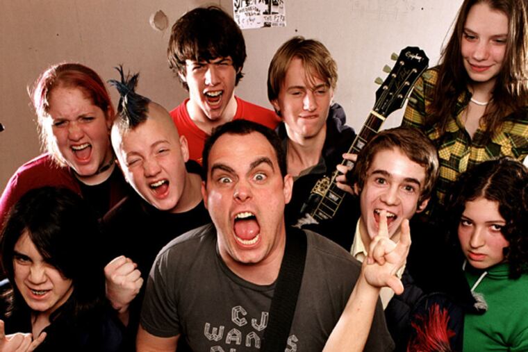 Paul Green and his charges at the Paul Green School of Rock Music.