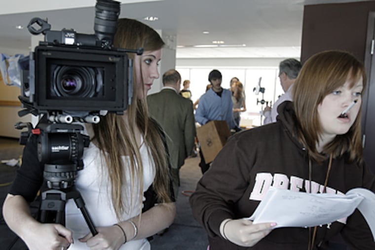 The student production crew of <i>University 101</i> at work on an episode of the show, which is filmed on Drexel's campus. (Akira Suwa/Inquirer)