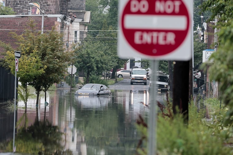 Flooding, at South 10th Street & Kaighns Avenue in Camden, caused by heavy rain last month, More random downpours are possible the next few days.