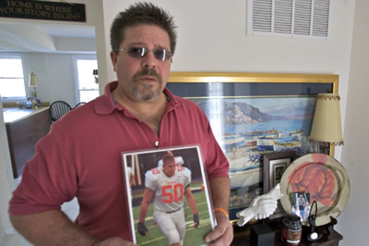 John Farrace holds a photo of his son Anthony, who was killed in a car crash two years ago. The Farraces want all drivers in fatal crashes tested. (John Costello / Staff Photographer)