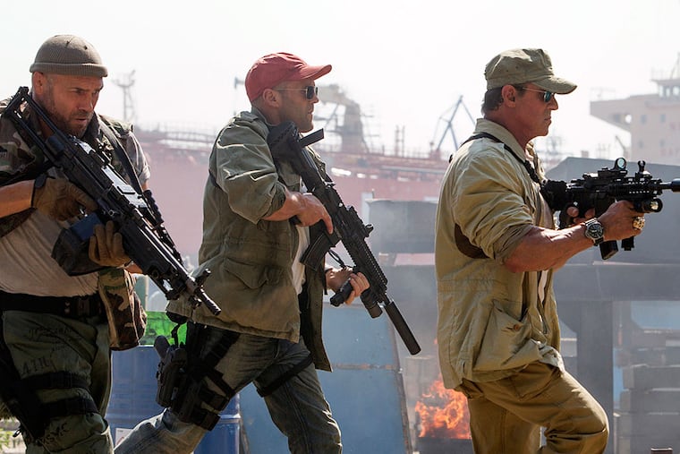 Some of the “Expendables” core warriors are (from left) Randy Couture as Toll Road, Jason Statham as Lee Christmas, and Sylvester Stallone as Barney Ross, leader of the off-the-books CIA squadron. PHIL BRAY