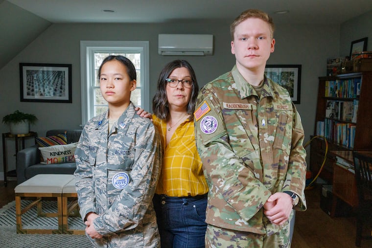 From left are Lydia Raudenbush, mother Kelly and brother Drew at their Phoenixville home on Thursday. Both Lydia and Drew Raudenbush are in the Phoenixville Area School District's Air Force JROTC program, which the Air Force plans to close at the end of the school year due to inadequate enrollment.