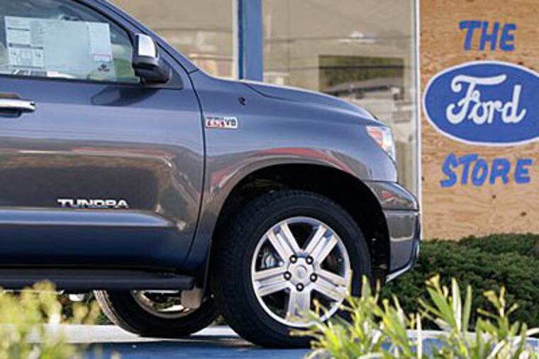 A new Toyota Tundra truck sits at a Ford dealership that closed Friday in Hayward, Calif. (AP Photo/Ben Margot)