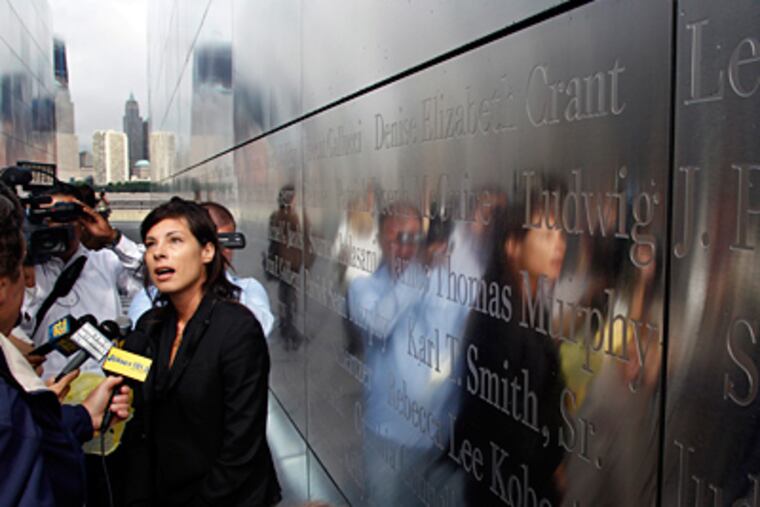 Co-architect Jessica Jamroz answers a question as she stands in the Empty Sky memorial Wednesday, Sept. 7, 2011, at Liberty State Park, in Jersey City, N.J., during a tour of the memorial which will be dedicated Saturday, Sept. 10. The Empty Sky memorial had to overcome protests from citizen's groups that said the monument obstructed views of lower Manhattan and that there wasn't enough public input on the project. (Mel Evans / Associated Press)