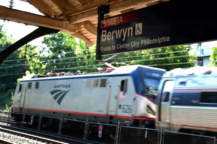 An Amtrak train passes through the SEPTA Regional Rail Berwyn Station in August.