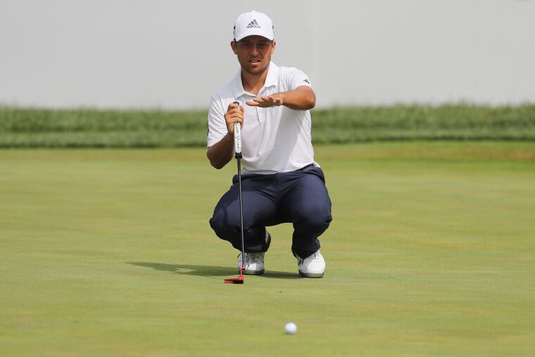 Xander Schauffele lines up a putt the 18th green at the BMW Championship at the Aronimink Golf Club in Newtown Square.