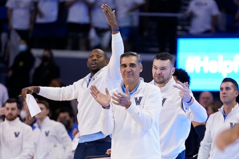 Villanova head coach Jay Wright claps from the bench during overtime against UCLA.