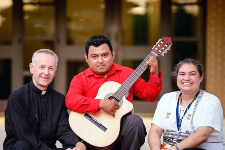 The Rev. David Tokarz, Francisco “Panchito” Elotlan, and Olga Villar. Elotlan won a spot on the 56-seat bus from Alabama to Philadelphia. (CHAD RILEY/For The Inquirer)