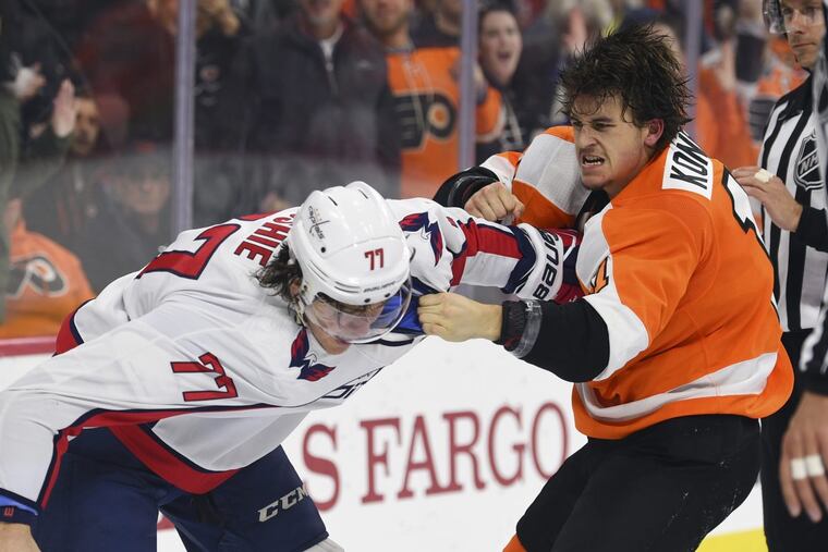 Travis Konecny and Washington’s T.J. Oshie slug it out in the third period of the Flyers’ 6-3 win Sunday.