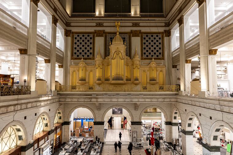 People gather inside Macy’s to listen to one of the last moments of hearing the Wanamaker Organ in Philadelphia, Pa., on Friday, Jan. 10, 2025.