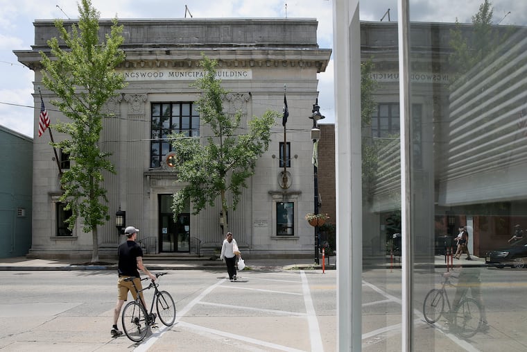 People cross Haddon Avenue in front of the borough hall in Collingswood, N.J., on Tuesday, June 26, 2018. TIM TAI / Staff Photographer