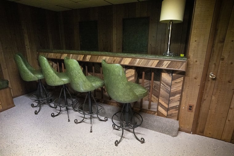 The house came with a finished basement that included a wood-paneled bar for entertaining.