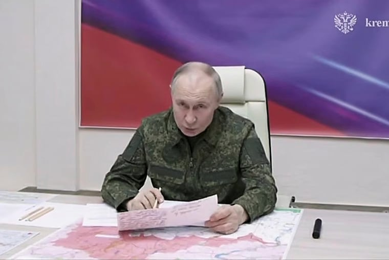 Russian President Vladimir Putin speaks during a visit to military headquarters in the Kursk region of Russia.