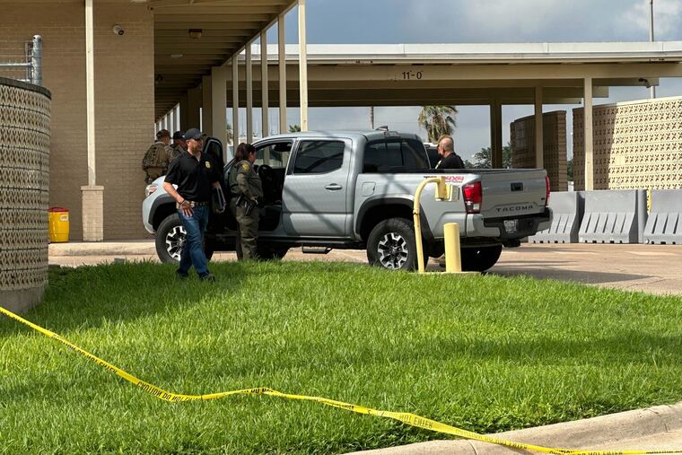 Officials work the scene of a shooting at a Border Patrol facility in McAllen, Texas, on Monday, July 7, 2025.