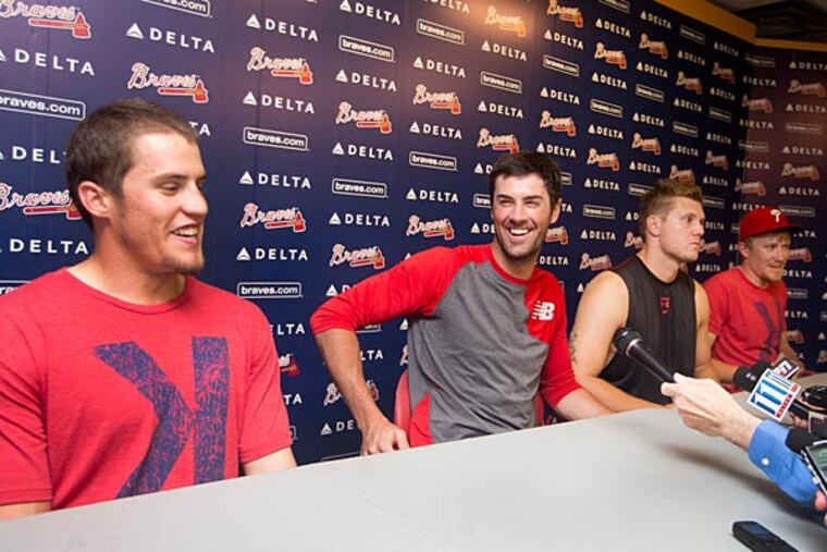 Philadelphia Phillies pitchers from left; Ken Giles, Cole Hamels,
Jonathan Papelbon and Jake Diekman joke during a news conference
after they combined efforts for a no-hitter against the Atlanta Braves
in baseball game Monday, Sept. 1, 2014, in Atlanta. Philadelphia won
7-0. (AP Photo/John Bazemore)
