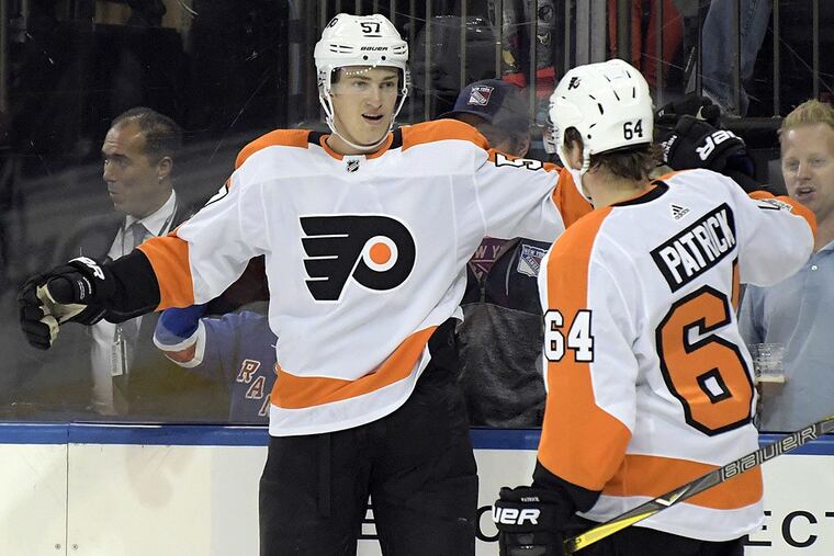 Philadelphia Flyers’ Travis Sanheim (57) celebrates his goal with Nolan Patrick (64) during the first period of an NHL hockey preseason game against the New York Rangers Monday, Sept. 25, 2017, at Madison Square Garden in New York.