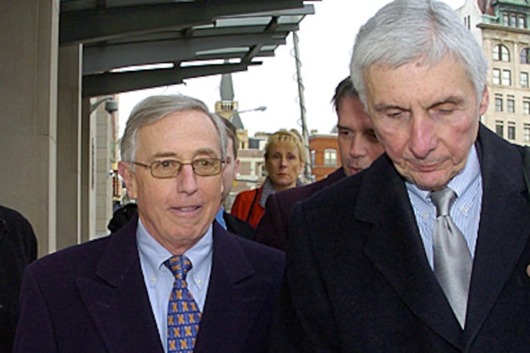 Former Luzerne County Judge Mark Ciavarella, left, with his attorneys Bill Ruzzo, right, and Al Flora Jr., back left, leave the federal courthouse in Scranton on Wednesday, after the jury began deliberating.