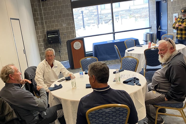 West Chester football coach Bill Zwaan (left) talking with (from left) Penn coach Ray Priore, Villanova coach Mark Ferrante, and Rowan coach Jay Accorsi.