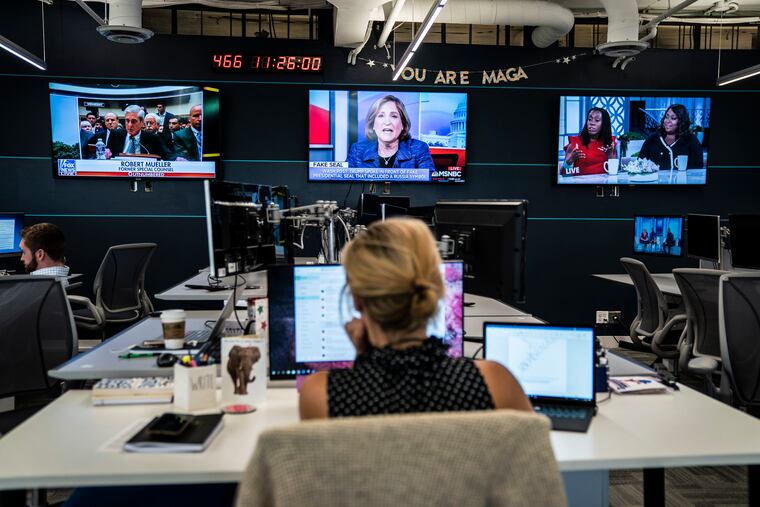 Employees for President Trump's 2020 reelection campaign work in July at the Republican National Convention annex in Arlington, Va.