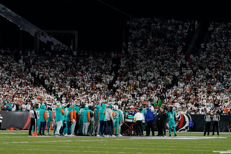 Miami Dolphins quarterback Tua Tagovailoa is taken off the field on a stretcher.