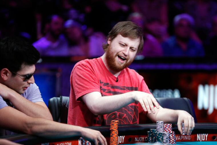 Joe McKeehen of North Wales smiles after winning a pot at the World Series of Poker tournament Tuesday. The final rounds of the contest will be in November. A Marlton man is also a contender. (JOHN LOCHER / AP)