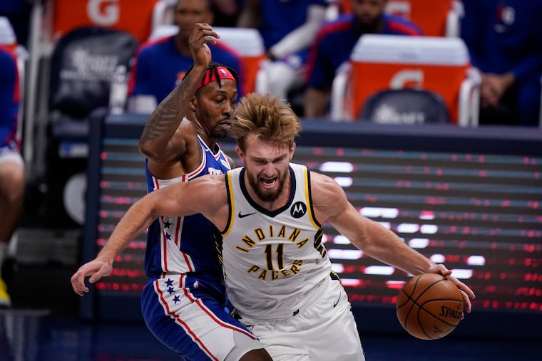 The Pacers' Domantas Sabonis (11) drives to the basket against the Sixers' Dwight Howard (39) during the second half of Friday night's preseason finale.
