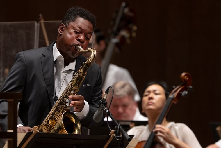 Ravi Coltrane performs with The Philadelphia Orchestra, conducted by Edwin Outwater, during a concert celebrating the 100th anniversary of jazz legend John Coltrane's birth at the TD Pavilion at the Mann in Philadelphia on Wednesday, July 22, 2026.
