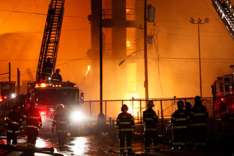 Two firefighters were killed when building walls collapsed.